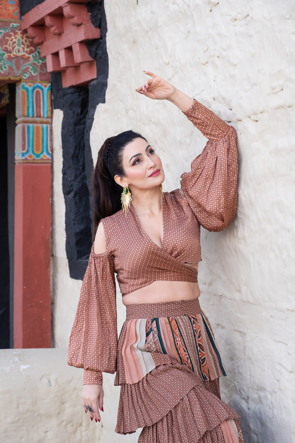 SHALINI PASSI IN TERRACOTTA QUATREFOIL KNOT BLOUSON AND TIER RUFFLE MIX PRINT SKIRT