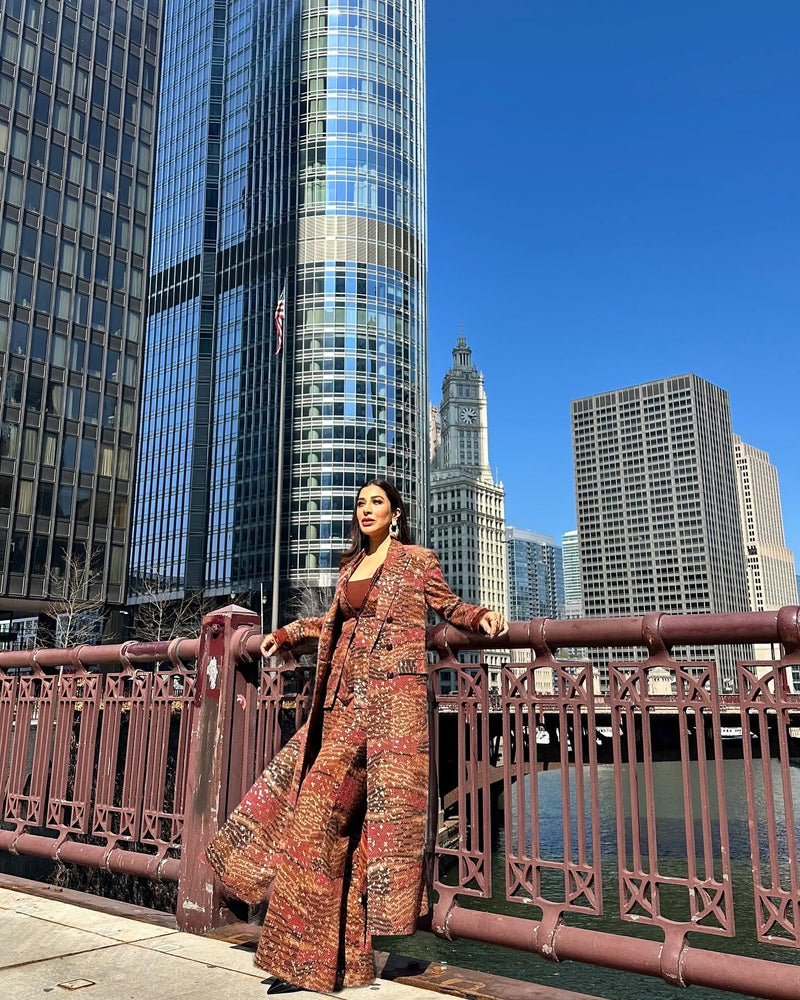 SOPHIE CHOUDRY IN TANGERINE BYZANTINE PRINT TRENCH COAT AND PANTS