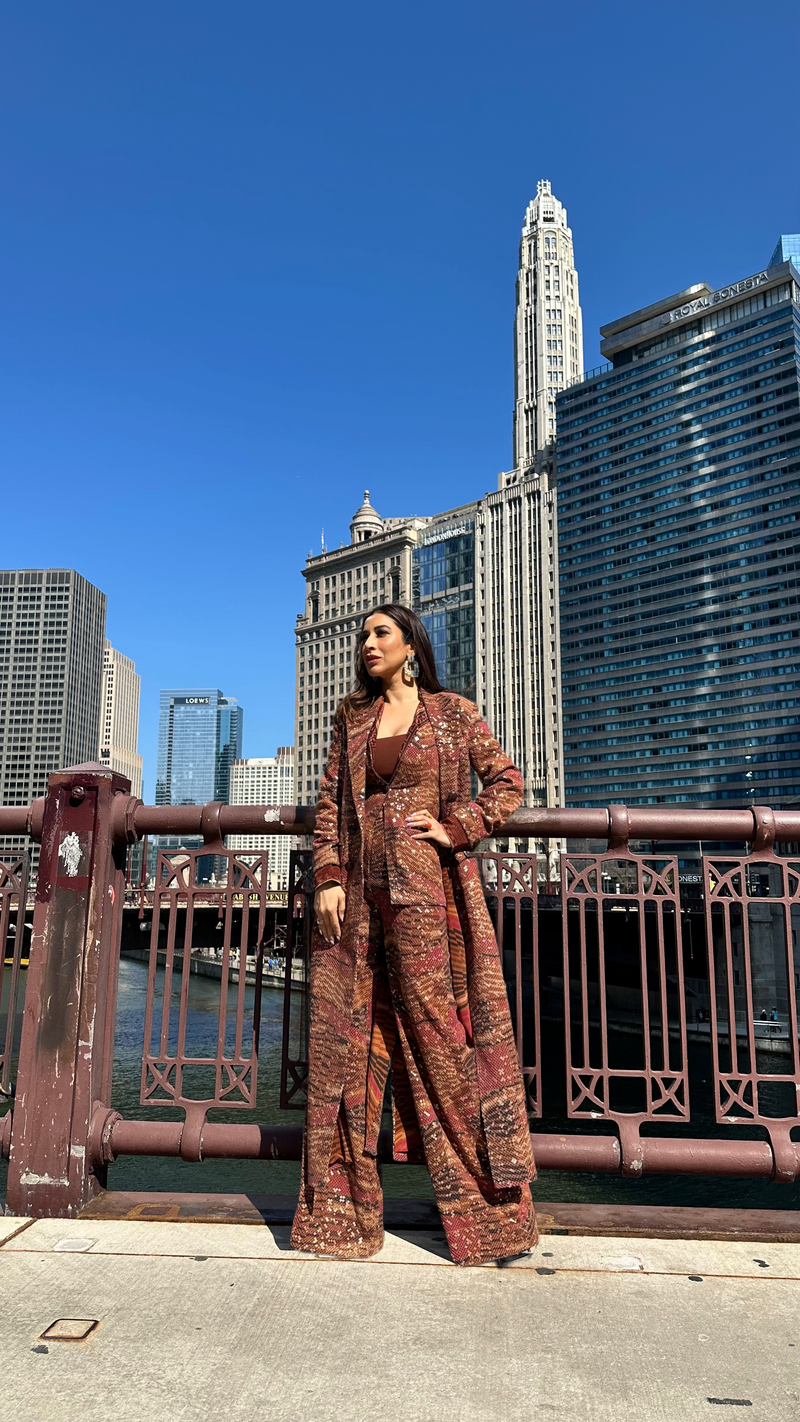 SOPHIE CHOUDRY IN TANGERINE BYZANTINE PRINT TRENCH COAT AND PANTS