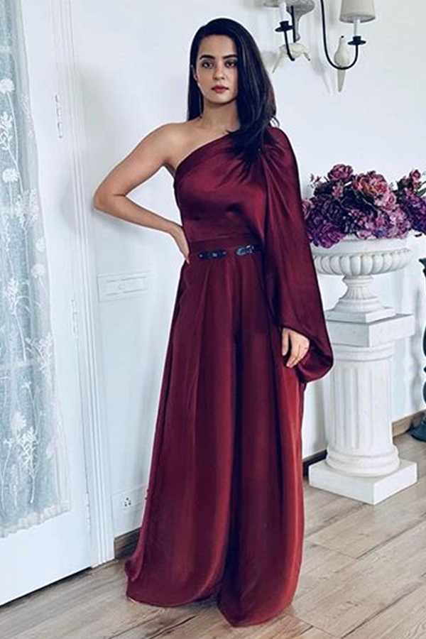 Surveen Chawla In Beetroot Draped Blouse With Leather Buckle Detail